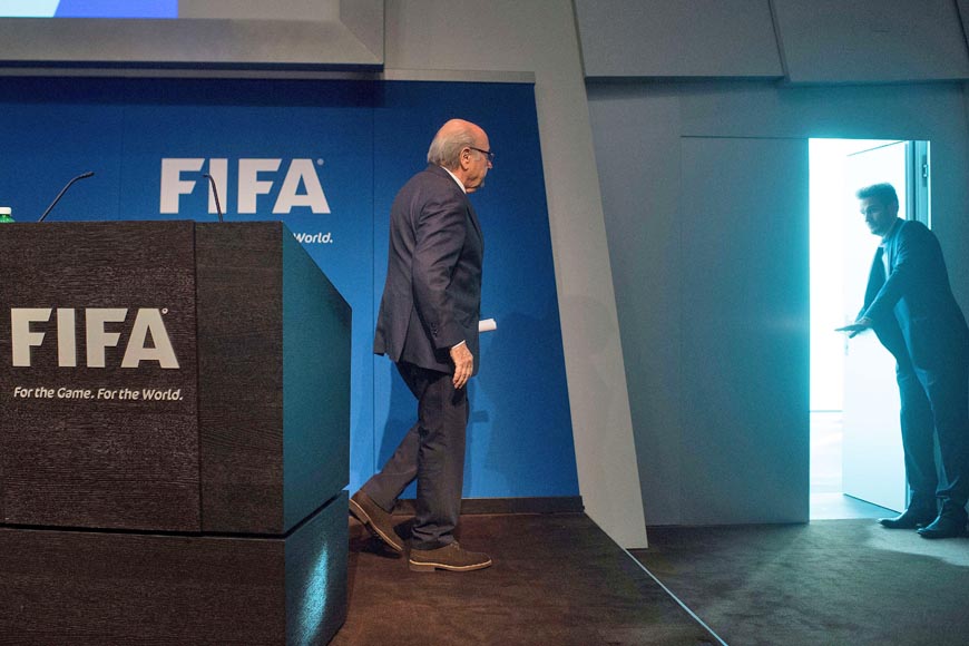 FIFA President Sepp Blatter leaves after a press conference at the headquarters of the world's football governing body in Zurich on Tuesday (AFP photo)
